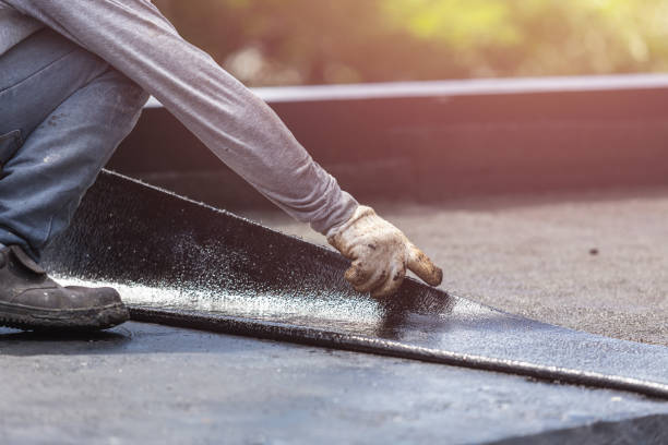Professional Waterproofing technician working in Grand Junction, MI